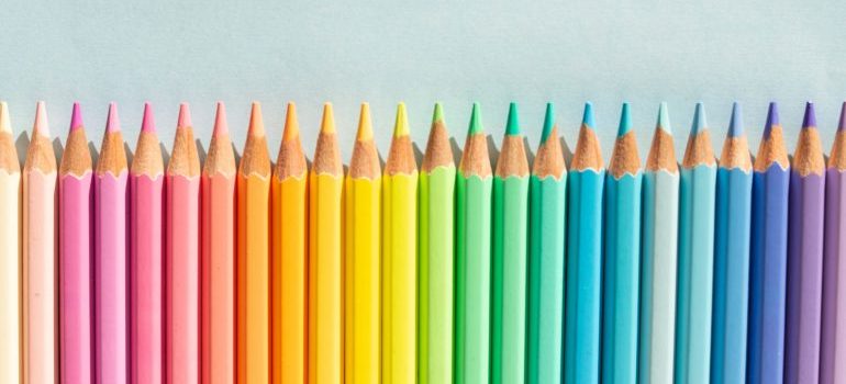 a row of neatly arranged coloured pencils