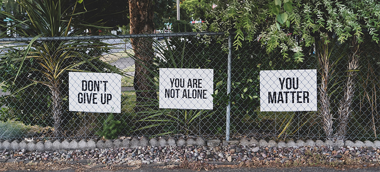 Motivation signs on a fence