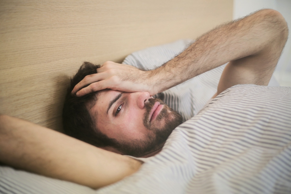 person wondering about How Does Alcohol Affect Sleep