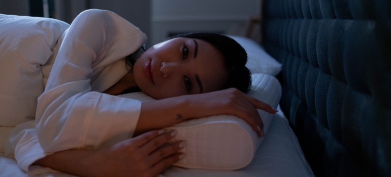 person trying to sleep and wondering about How Does Alcohol Affect Sleep