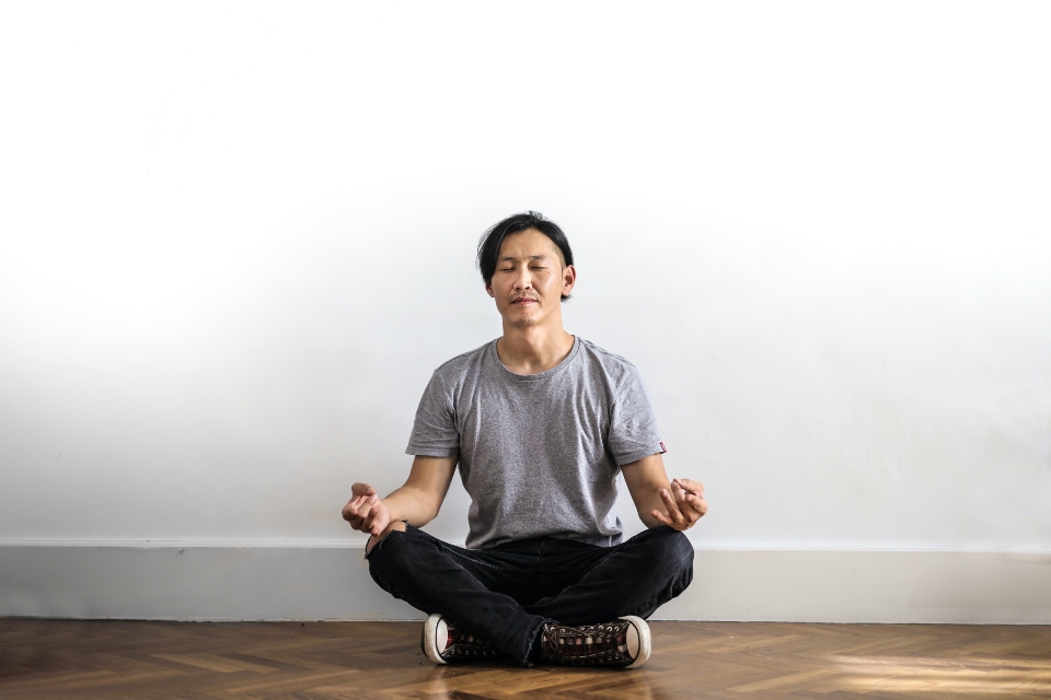 person managing OCD and substance abuse triggers by meditating