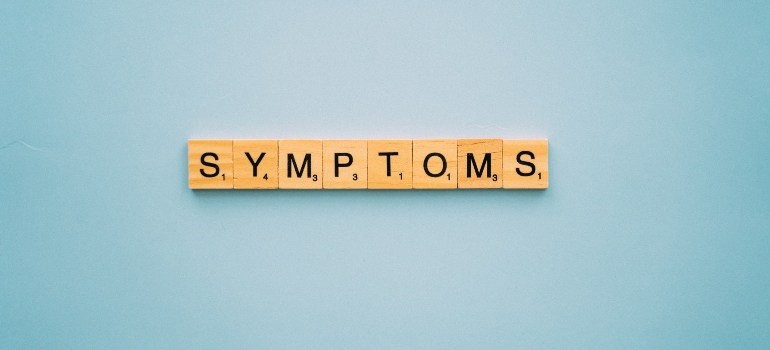 blocks spelling the word "symptoms"