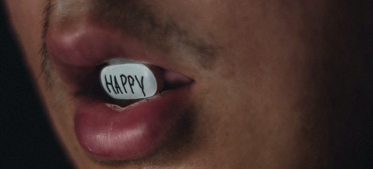 person chewing on a happy pill