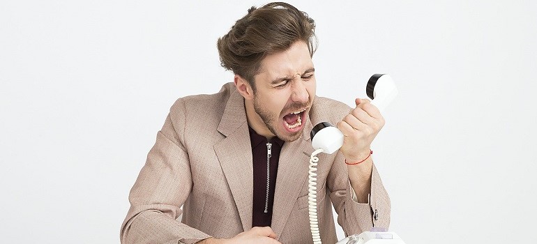 Man yelling into phone.