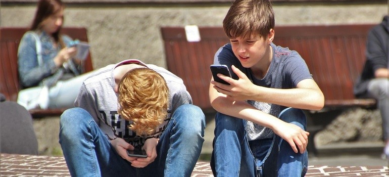 Kids using smartphones.